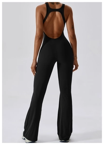 Back view of a black backless flare yoga bodysuit with racerback straps and slim fit
