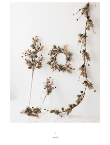 Macro detail of artificial pine cone wreath and golden berries Christmas decoration set