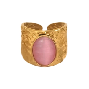 Detail of 18K gold stainless steel ring with pink gemstone and hammered texture