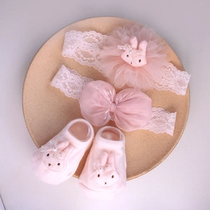 Pink infant lace headband and socks set with cute bunny ears and soft mesh flower detail