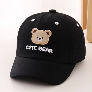Close-up of cute bear embroidery and fine cotton texture on kids black baseball cap