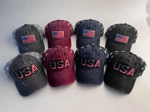 Close-up of distressed baseball caps with USA embroidery and star mesh detailing