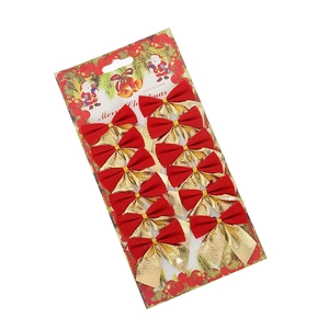 Set di 12 fiocchi di Natale rossi e oro per decorazioni su confezione di cartone