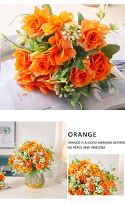 Detalle de rosas naranjas artificiales con hojas verdes para decorar el hogar