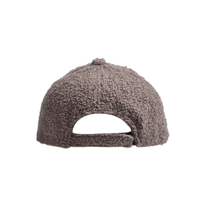Detail view of the brown lamb wool baseball cap featuring textured fabric and adjustable back strap
