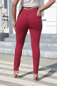 Rear view of high-waisted wine red skinny jeans in stretchy washed denim fabric