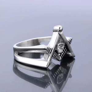 Macro side view of solid stainless steel Masonic ring with polished square and compass