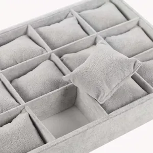 Gray velvet watch display tray with rectangular compartments and soft pillows 8cm