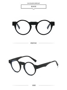 Detail view showing front and side profile of black round vintage style sunglasses