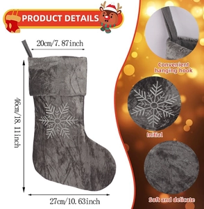 Detailed view of grey plush Christmas stocking with white snowflake embroidery and size dimensions