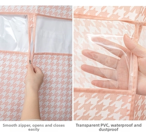 Detail of dust cover featuring pink houndstooth pattern and clear PVC viewing window