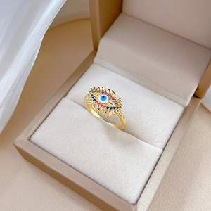 Adjustable gold evil eye ring with blue enamel and colorful zircon in a gift box