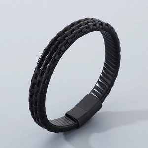 Detail of multi-layer black braided leather bracelet with matte black magnetic clasp