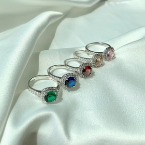 Detailed macro view of S925 sterling silver rings set with colorful square zircons