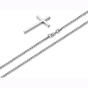 Macro shot of silver polished titanium steel cross pendant and durable box chain links