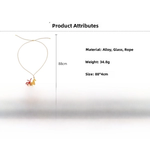 Detailed specs of horse pendant necklace with red crystal tail and long rope chain
