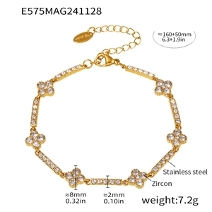 Detailed view of gold plated stainless steel clover bracelet with sparkling zircon stones