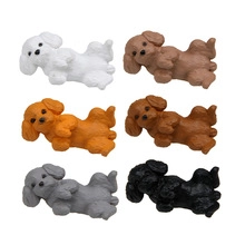 Detailed view of six miniature dog figurines in various colors on a plain white background