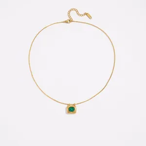 Detailed spec sheet of a gold stainless steel necklace with green stone pendant