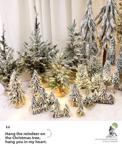 Mini lighted Christmas trees with faux snow flocking and rustic burlap wrapped bases