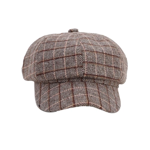 Classic British plaid newsboy cap in brown and beige tones for fall fashion style