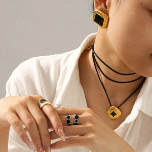 Vintage hammered square earrings and matching necklace jewelry set on female model