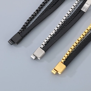 Close-up of multilayer braided leather bracelets with steel chains and magnetic clasps