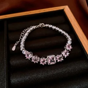 Elegant French style square pink gemstone bracelet with sparkling zircon halo on black velvet