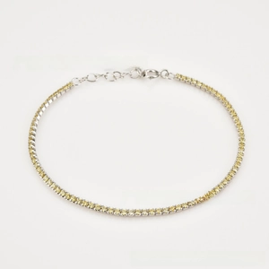 Detailed macro of S925 silver tennis bracelet with yellow zircons and lobster clasp