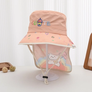 Detail of pink kids sun hat with neck flap featuring cute embroidery and rabbit patterns