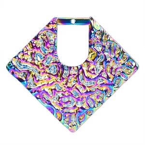 Macro shot of colorful rhombic stainless steel jewelry pendant with textured surface