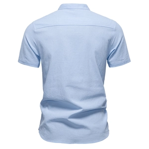 Back view of light blue short-sleeved cotton linen shirt with a classic stand collar