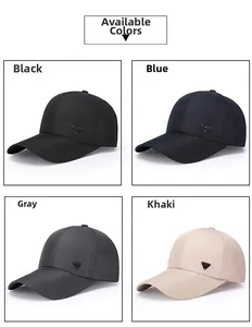 Detail view of four casual baseball caps in black blue grey and khaki with metal logo