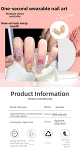 Detail of heart pattern press-on nails with small rhinestones and pink gradient base