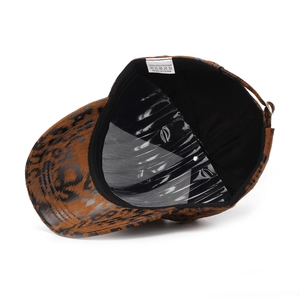 Close-up of leopard print baseball cap interior showing 100% polyester wash label