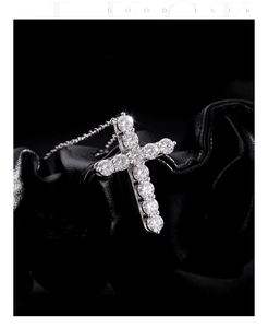 Macro shot of s925 silver cross pendant featuring sparkling round cut moissanite stones