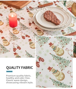 Detail of quality Christmas snowman fabric with festive tree prints and wavy edge design