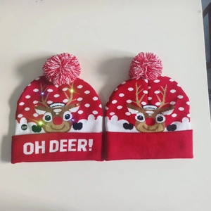 Detail showing LED switch and Oh Deer text on knitted Christmas reindeer hat