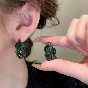Vintage green crystal hoop earrings with geometric rhinestones shown on model and side view