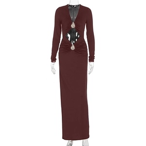 Detailed view of the diamond cutout and teardrop rhinestone decor on the burgundy dress