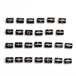 Set of 26 black acrylic cylinder beads with gold alphabet letters for DIY jewelry making