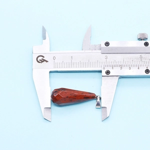 Caliper measuring 3.2cm faceted teardrop natural stone pendant with silver clasp