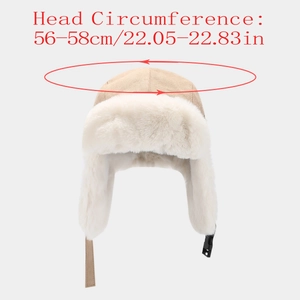 Detailed view of beige suede winter trapper hat with soft white faux fur lining and buckle