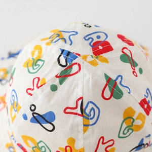 Close-up top view of kids reversible sun hat with colorful graffiti abstract pattern