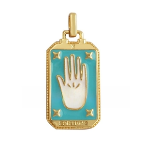Macro view of a gold-plated Hamsa Hand tarot charm with green enamel and Fortune text