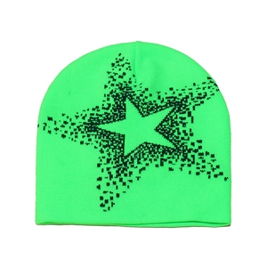 Detail of neon green knitted beanie with black pixelated star pattern texture