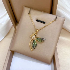 Macro shot of dragonfly necklace with enamel wings and sparkling inlaid crystals
