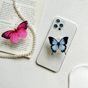 Pink and blue butterfly acrylic collapsible grip stand for smartphones on marble surface
