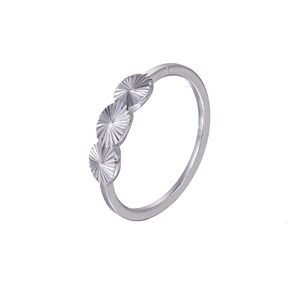 Minimalist silver metal ring with three textured round patterns on a white background