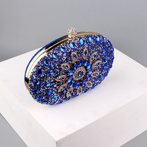 Detailed view of blue rhinestone evening clutch with crystal floral pattern and gold metal frame